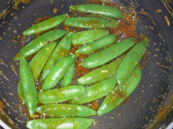 Add snap peas and stir until coated with sauce and just warmed through.  